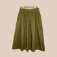 Green pleated skirt